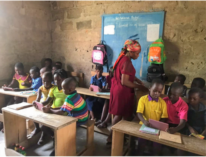 Students in a classroom using tablets during a Strive2Thrive lesson