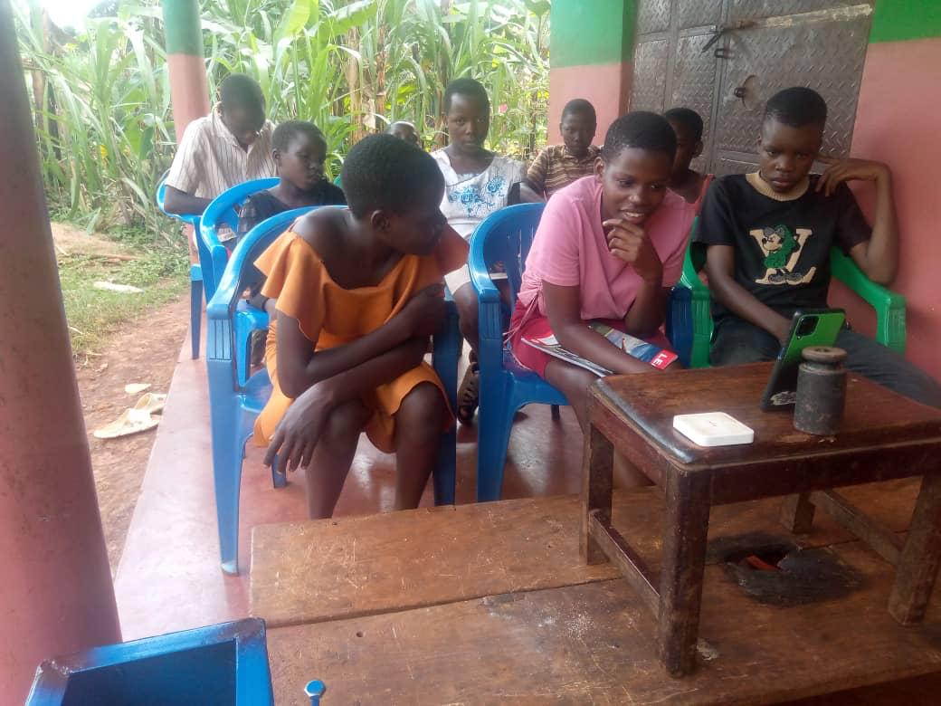 Volunteer tutor teaching a class in Uganda